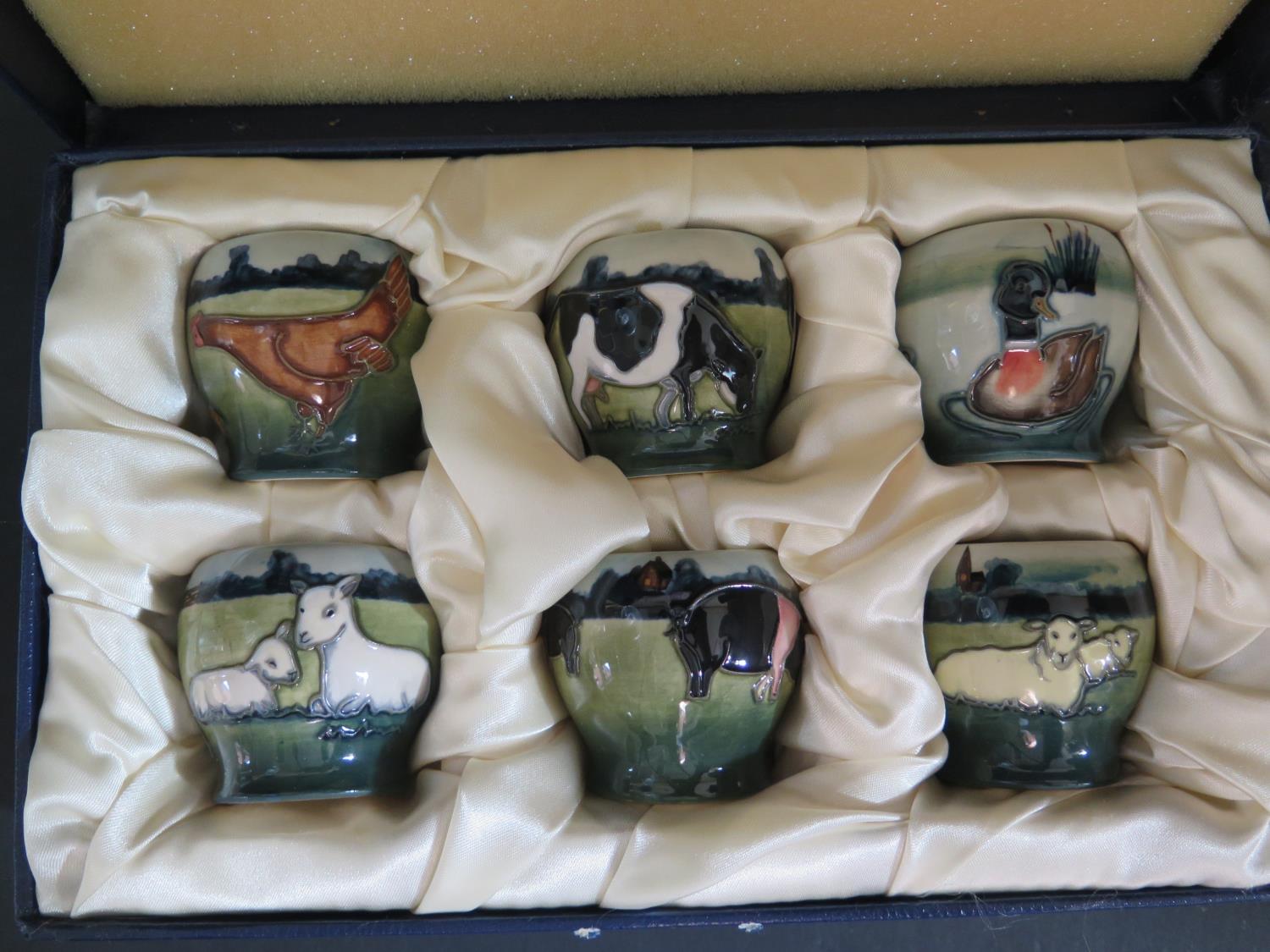 A Cased Set of Six Modern Moorcroft Farmyard Egg Cups 98