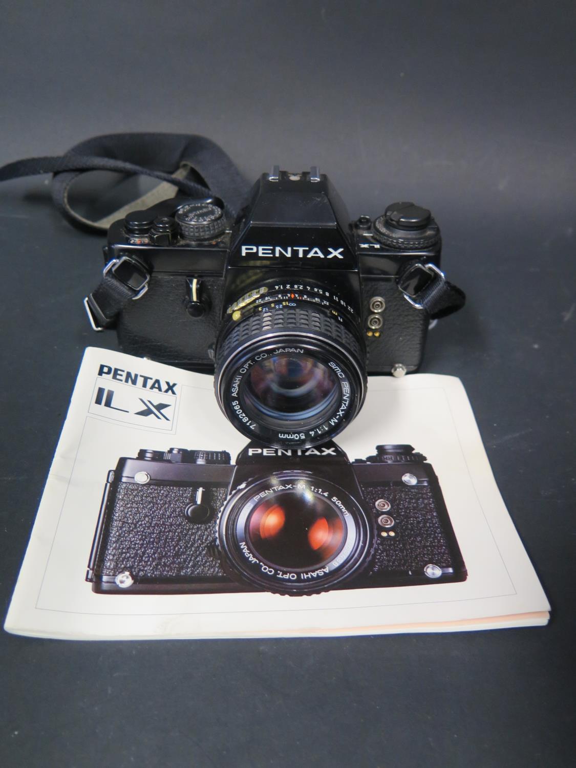 A Vintage Pentax SLR Film Camera with SMC Pentax-M 1:1.4 50mm Lens with manual