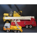 A Tonka Fire Engine, Crane Truck and a Tinplate Skip Truck (missing skip) made in France