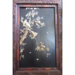A Japanese Meiji Period Ivory Relief Picture of birds with inset mother of pearl eyes sitting on