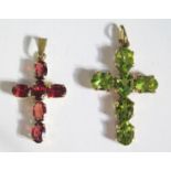 A Peridot (36mm drop) and Garnet Cross Pendants in 9ct gold mounts, 4.6g