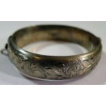 A Birmingham Silver Hinged Bangle with chased foliate decoration, 1969, 26.7g