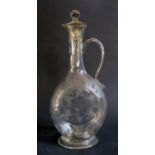 An Eighteenth Century Glass Claret Jug and Cover with cut and etched decoration, 28cm