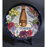 A Modern Moorcroft Limited Edition Centenary Plate 1997, 610/750, 22cm, boxed with certificate, cost
