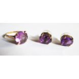 An Egyptian Gold and Amethyst Ring (size P, 3.4g) and pair of 9ct gold and amethyst stud earrings,