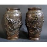 A Pair of Japanese Bronze Vases with relief dragon decoration, 30cm high