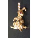 An 18ct Gold, Ruby and Diamond Rabbit Brooch, 3.8g, 24mm high