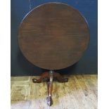 A 19th Century Mahogany Tilt Top Pedestal Table with acanthus leaf carved tripod base terminating in