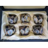 A Cased Set of Modern Moorcroft Floral Decorated Egg Cups 2004