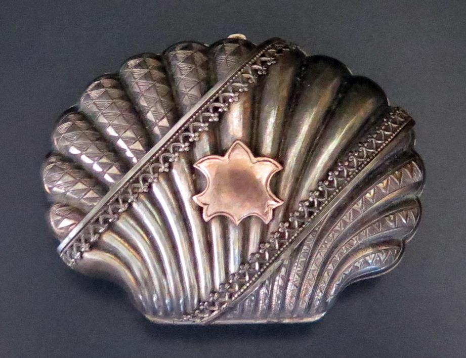 A Victorian Silver Scallop Shaped Purse fitted with three silk lined compartments, Birmingham