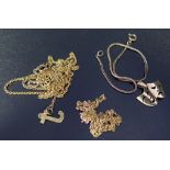 A 14K Gold Necklace (2.2g), 9ct gold necklace, mask pendant and one other chair (6.1g) and one