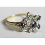 A Modern 18ct Gold, Sapphire and Diamond Flower Head Ring, size U.5, 4.6g