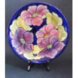 A W. Moorcroft Floral Decorated Blue Ground Plate, 28cm