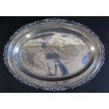 A Peruvian Silver Oval Platter with scrolling border, stamped 'Industria Peruana Plata Esterlina 925