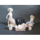A Lladro Figurine, Four Boxed Nao Figurines and London 2012 Glass Votive