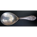 An Edward VII Silver Caddy Spoon with floral decoration to the handle. Birmingham 1907, Levi &