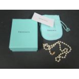 A 9ct Gold Bead and Simulated Pearl Necklace in a Tiffany & Co box and soft sleeve, c. 40cm long,