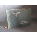 A WWII German Erinnerungen an meine Dienstzeit Photograph Album, having belonged to a Luftwaffe