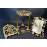 An Art Deco Brass Easel Back Mirror, R.S.P.C.A. 1933 Merit Badge and two trivet