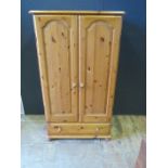A Small Pine Double Wardrobe with single drawer under
