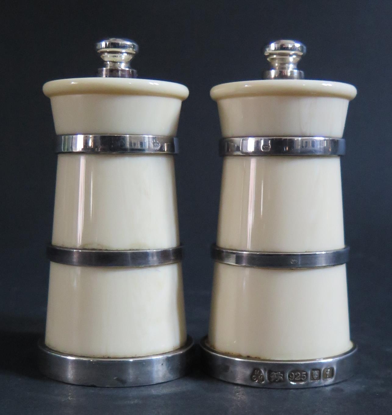 A Pair of Silver Mounted Faux Ivory Salts and Peppers, London 1980, M C Hersey & Son Ltd., 9.5cm
