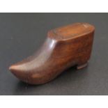 A Carved Treen Shoe with sliding compartment to top
