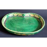 A Chinese Earthenware Dish decorated with a mountainous landscape, mark to base, 28.5cm wide