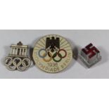 A 1936 XI Olympiade Berlin Enamel Badge (H. Osang), Participant's badge (Paulmann & Crone) and Day