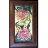 A Pair of Modern Moorcroft Floral Tiles in an oak frame, 40x24cm