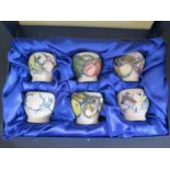 A Modern Moorcroft Boxed Set of Six Fruiting Blossom Decorated Egg Cups 2003