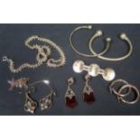 A Selection of Silver Jewellery including a pair of hoop earrings, necklaces, earrings, two torque