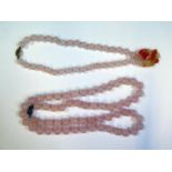 Two Chinese Rose Quartz Bead Necklaces with silver filigree clasps, one with a carved and pierced