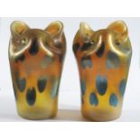 A Pair of Loetz Iridescent Glass Vases decorated with wavy horizontal lines and lily pads on
