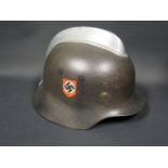 A WWII German 3rd Fireman's Helmet, rim stamped VDNS64