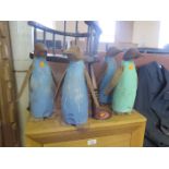 Four Carved Wooden Penguins