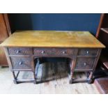 A Carved Oak Desk (144cm wide) and Victorian side chair