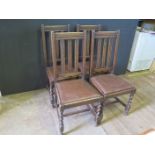 A Set of Four Oak Slat Back Dining Chair