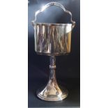 A Floor Standing Champagne Ice Bucket with swing handle, 71.5cm to top of handle