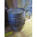 A French Carved Oak Bar Barrel trolley with twin hinged doors opening to compartment for bottles, c.