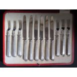 A George V Red Morocco Cased Set of Six Fruit Knives and Forks, Sheffield 1917, Thomas Bradbury &