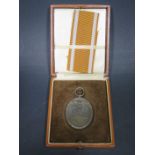 A WWII German West Wall Medal in rare presentation case and with ribbon, appears unused