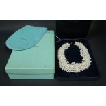 A Tiffany & Co Eight Strand Pearl Necklace with 18K Gold Clasp, c. 42cm long, 208g, boxed and with