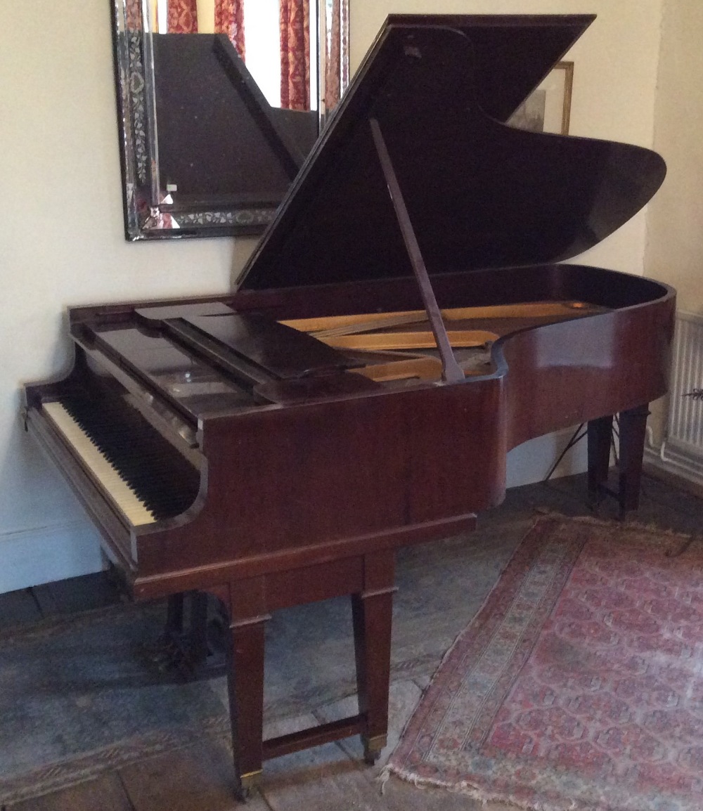 Steinway (c1928) A 6ft 4in converted player piano in a mahogany case on dual square tapered legs.