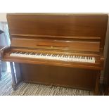 Steinway (c1909) An upright piano in a mahogany case.