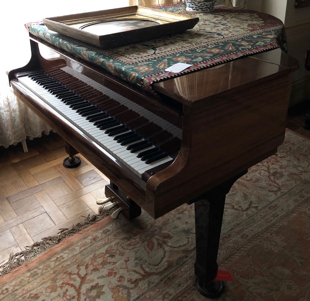 Blüthner (c1985) A 5ft 1in Model 11 grand piano in a bright mahogany case on square tapered legs.