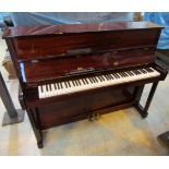 Challen (c1996) An upright piano in a traditional bright mahogany case.