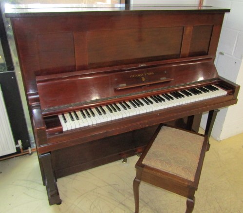 Steinway (c1921) A Vertegrand upright piano in a mahogany case; together with a stool.