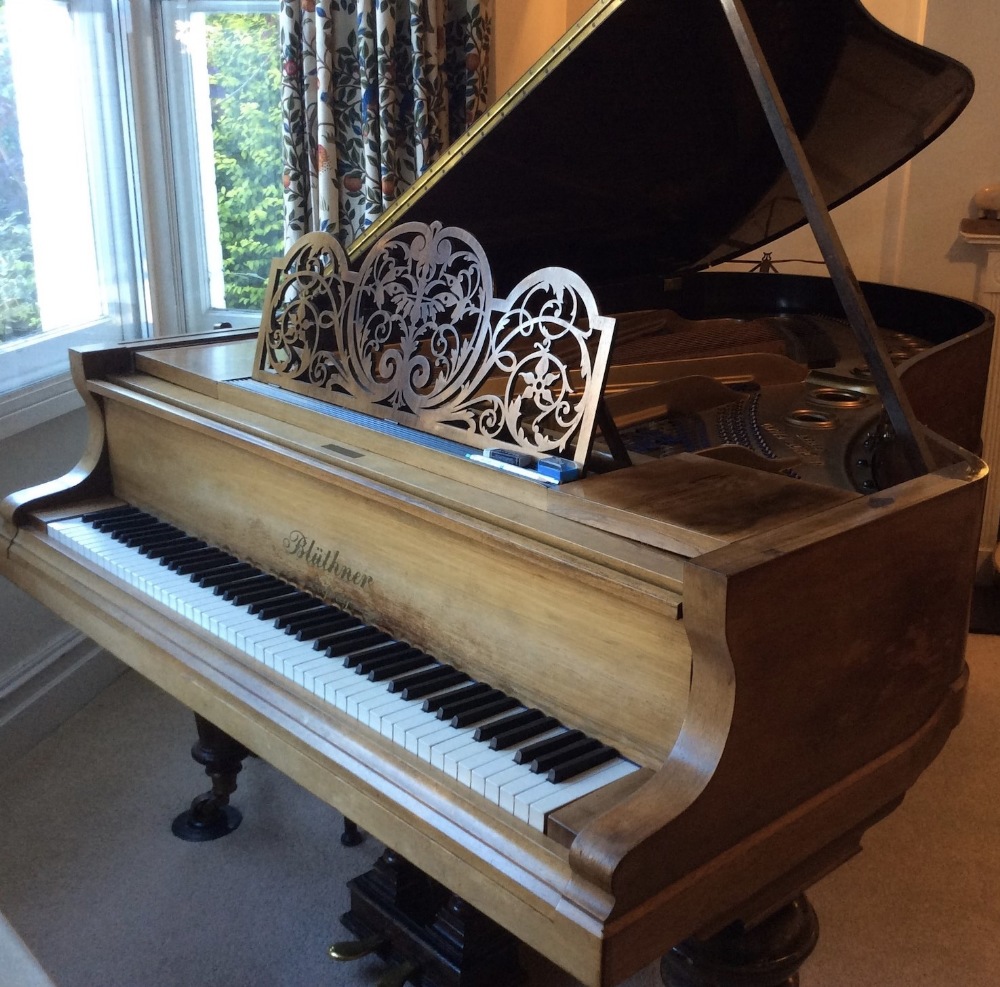 Blüthner (c1897) A 6ft 9in grand piano in a rosewood case on turned and fluted legs.