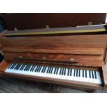 Welmar (c1994) An upright piano in a modern style mahogany case. AMENDMENT Is in a walnut case.