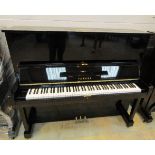 Yamaha (c1965) A Model U3C upright piano in a bright ebonised case.